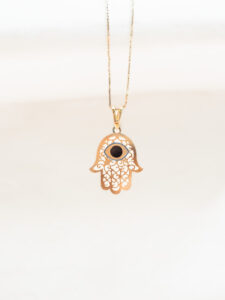 black evil eye hamsa hand pendant